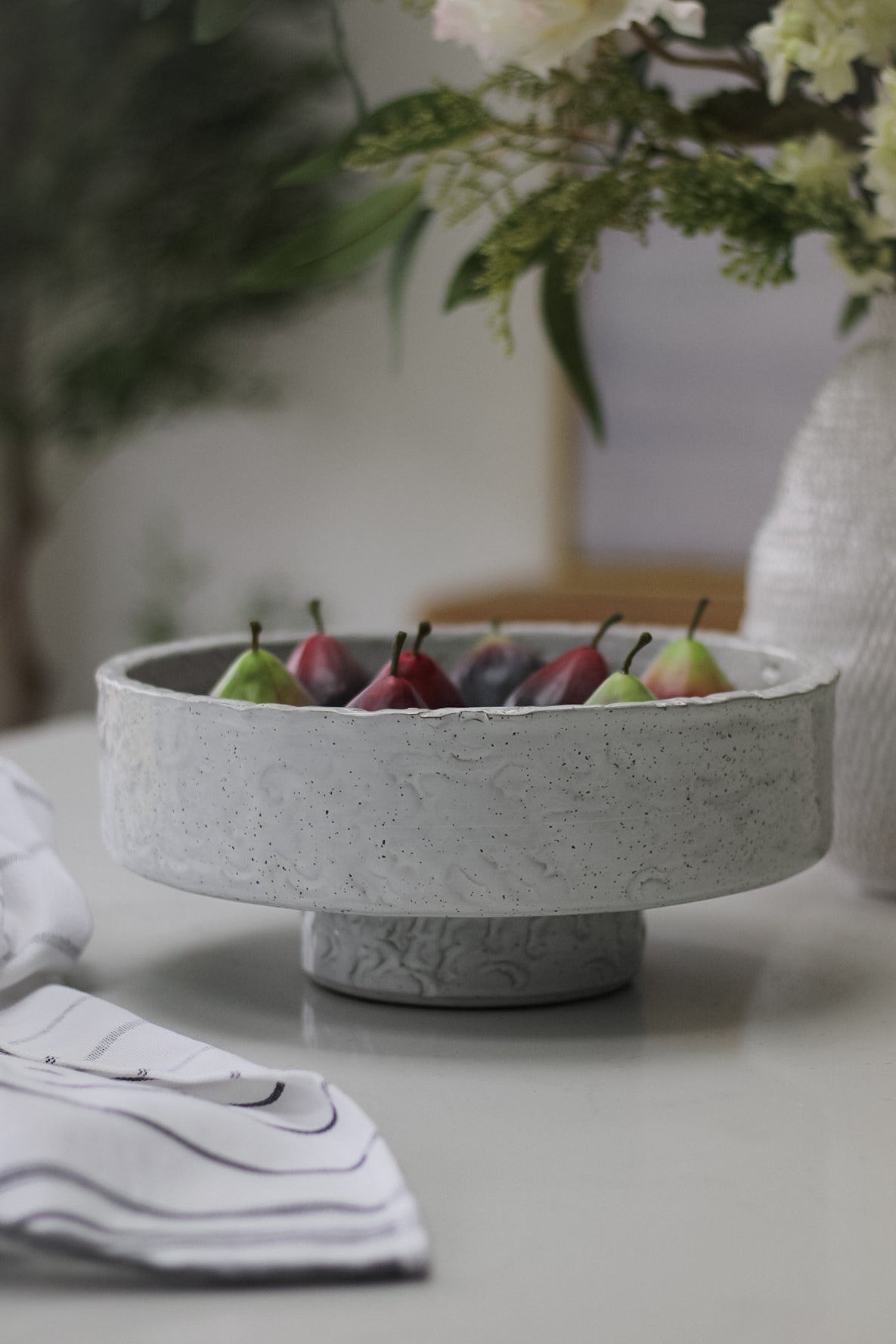 pedestal bowl with figs on kitchen island