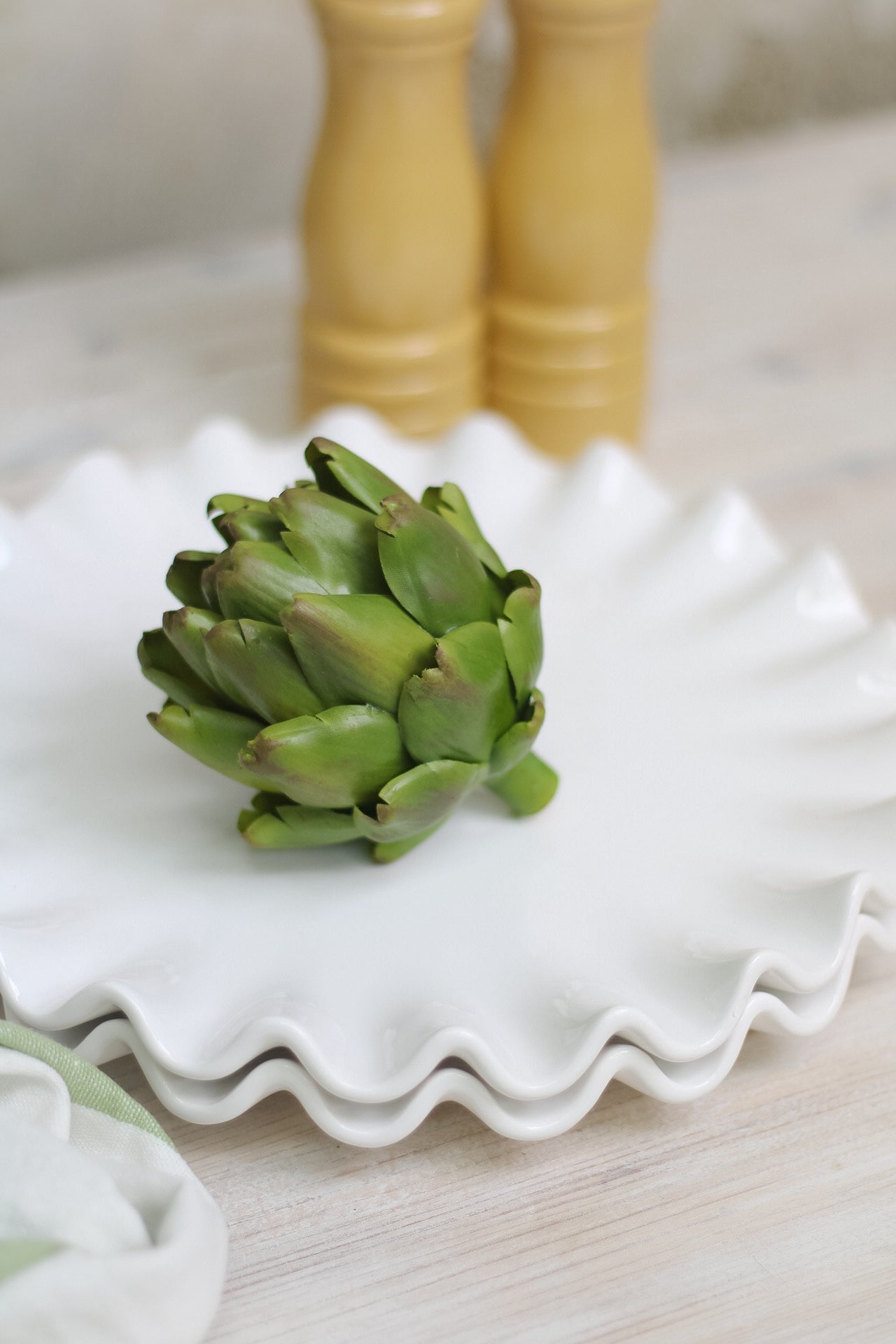 up close of faux green artichoke