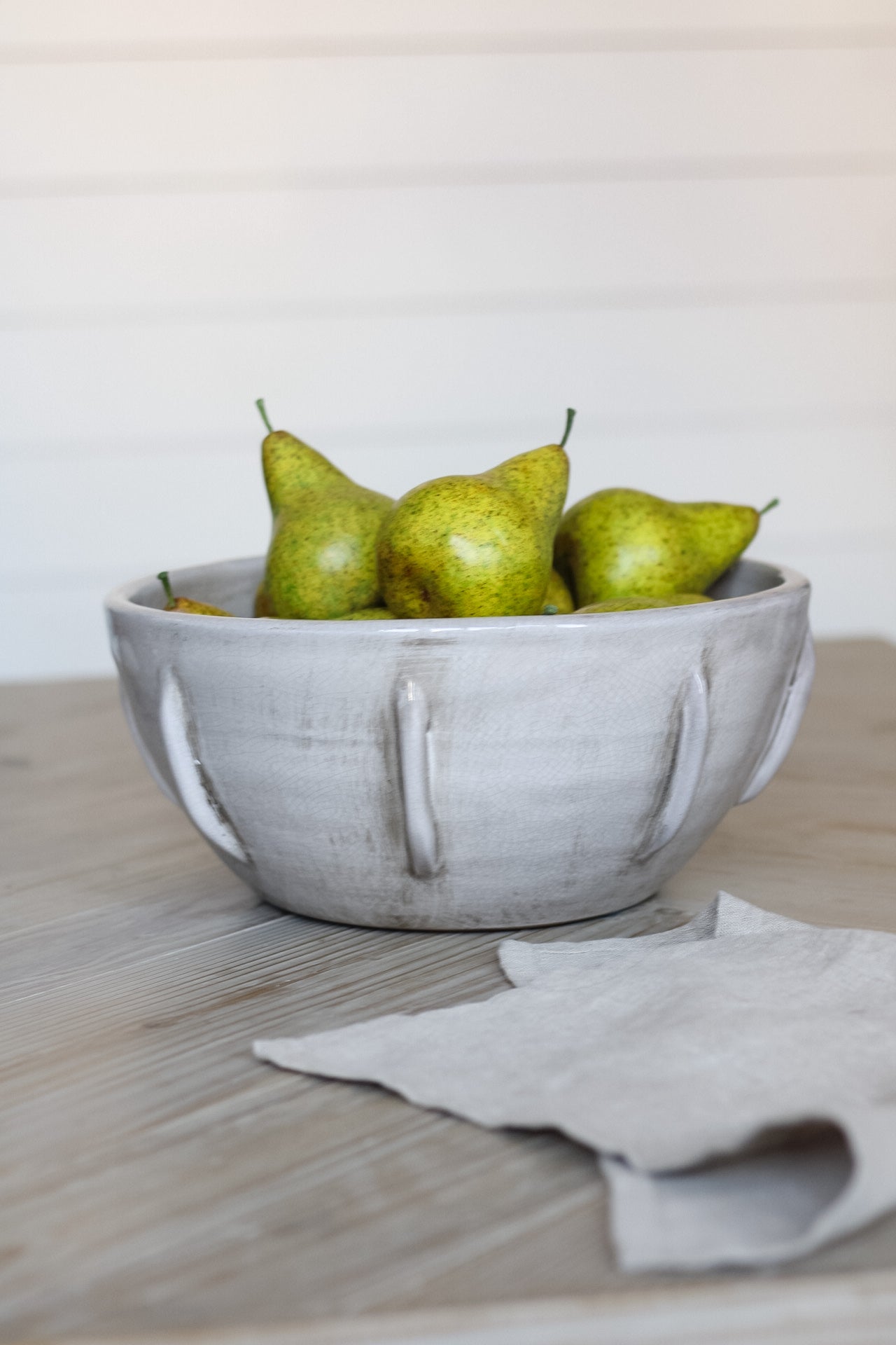 faux conference pears in rustic grey bowl