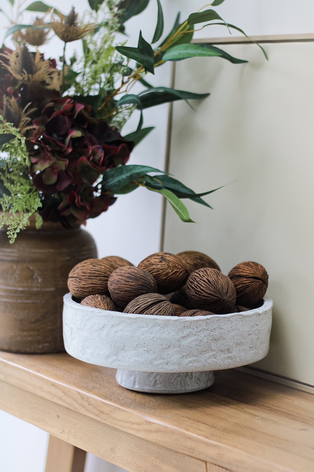 pedestal bowl filled with mintolla seeds for home decor