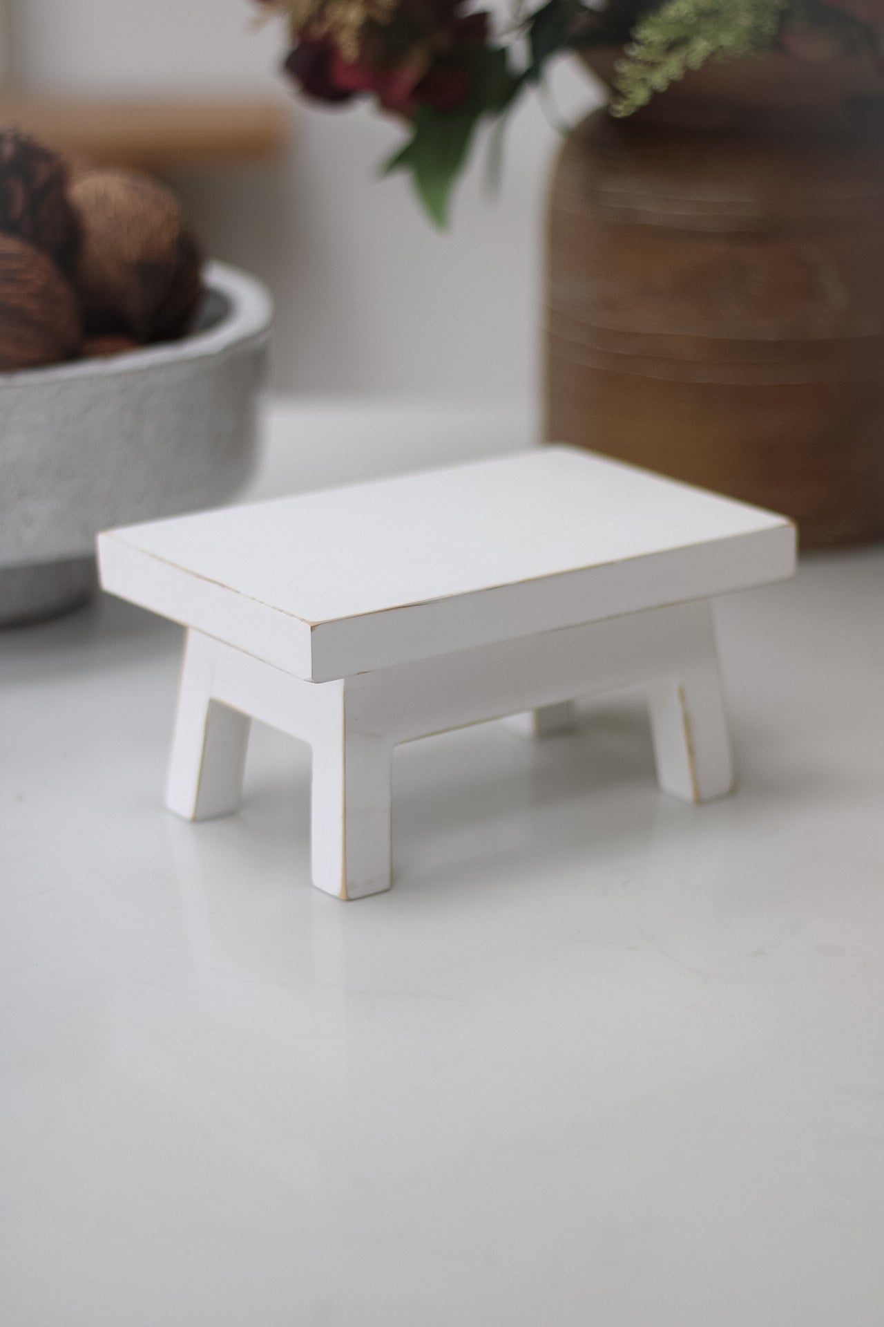 side of mini white rustic bench