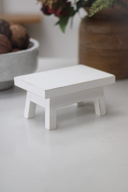 side of mini white rustic bench