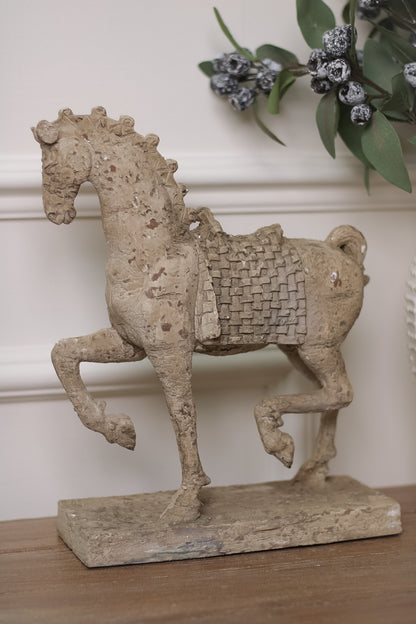 Horse sculpture on wooden table