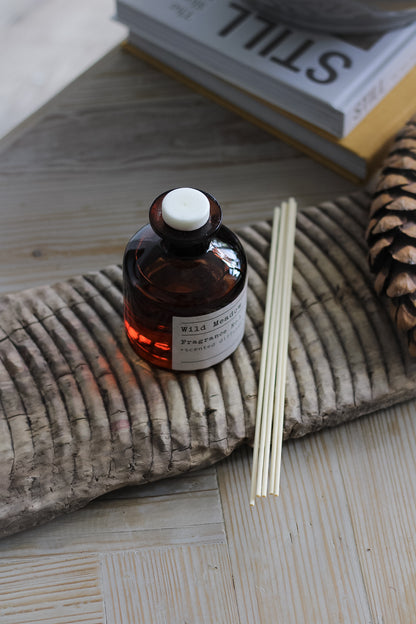 Wild Meadow Reed Diffuser on vintage wooden wash board