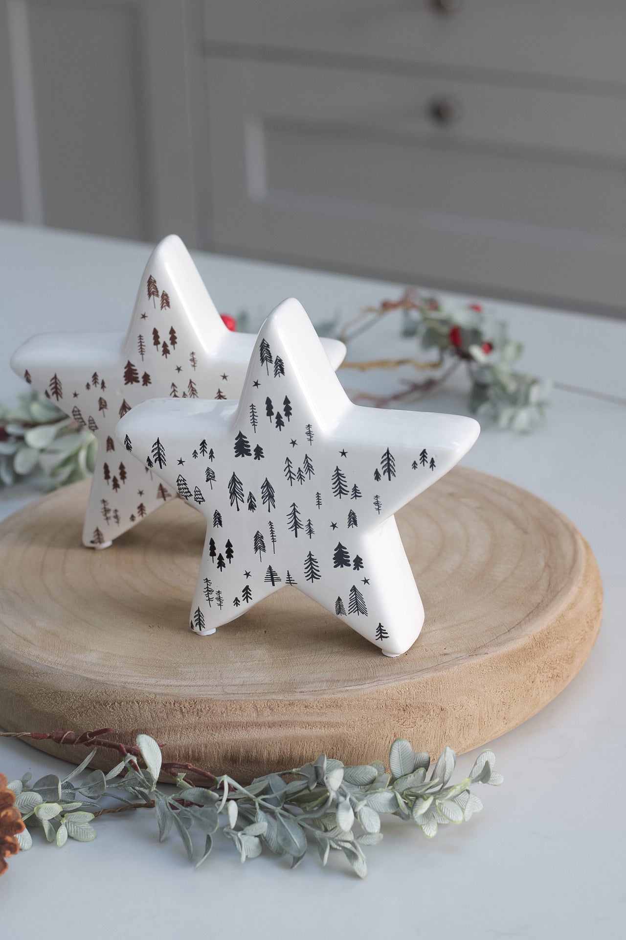 White Ceramic Stars with Brown and Black Trees