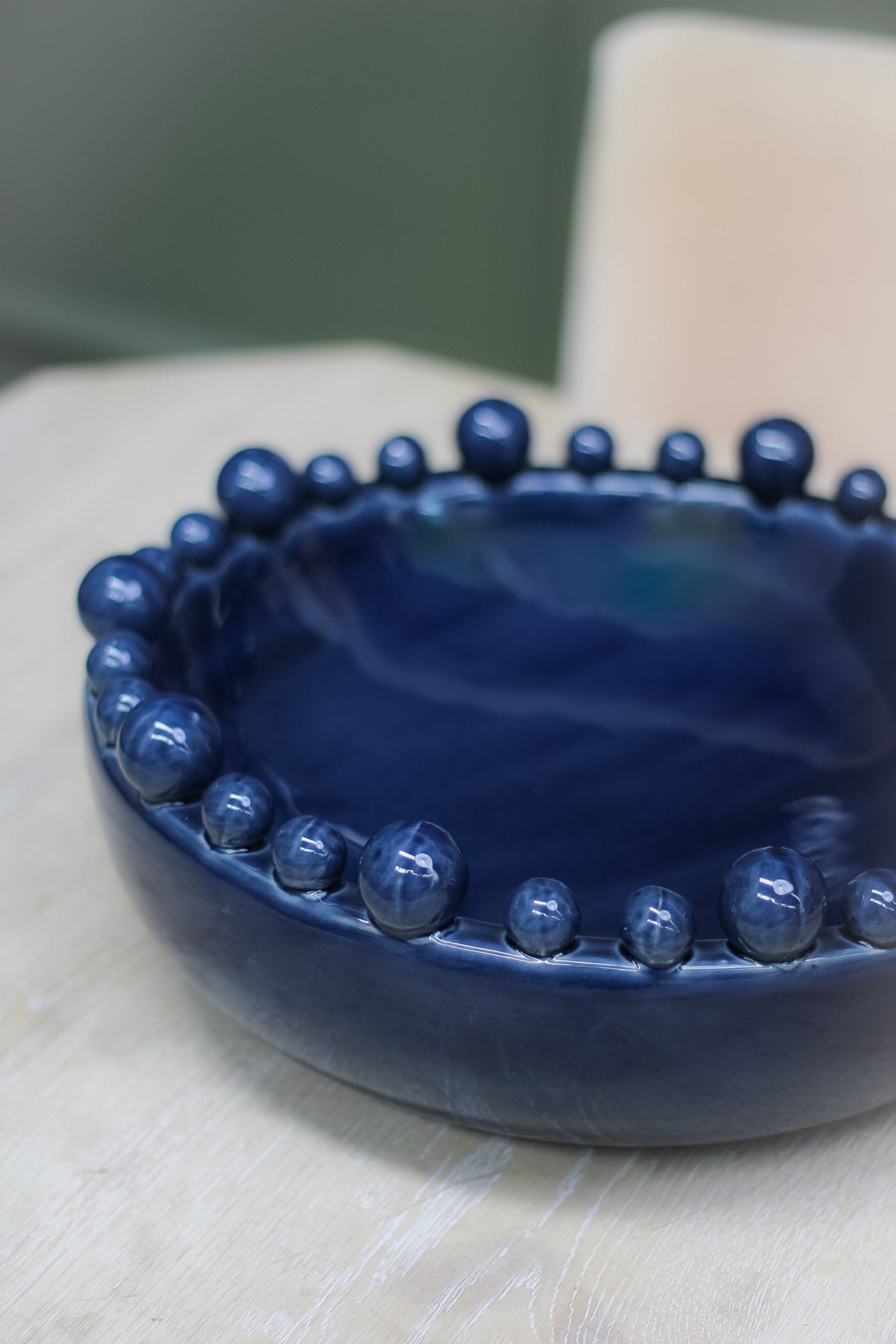 Upclose of dark blue round bobble edged bowl