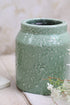 up close of rustic green vase