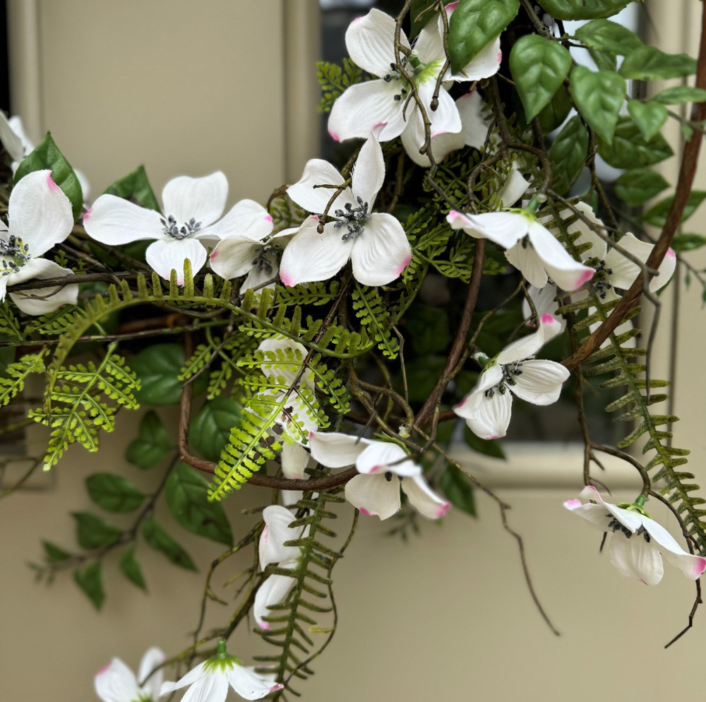 up close of spring dogwood and fern wreath