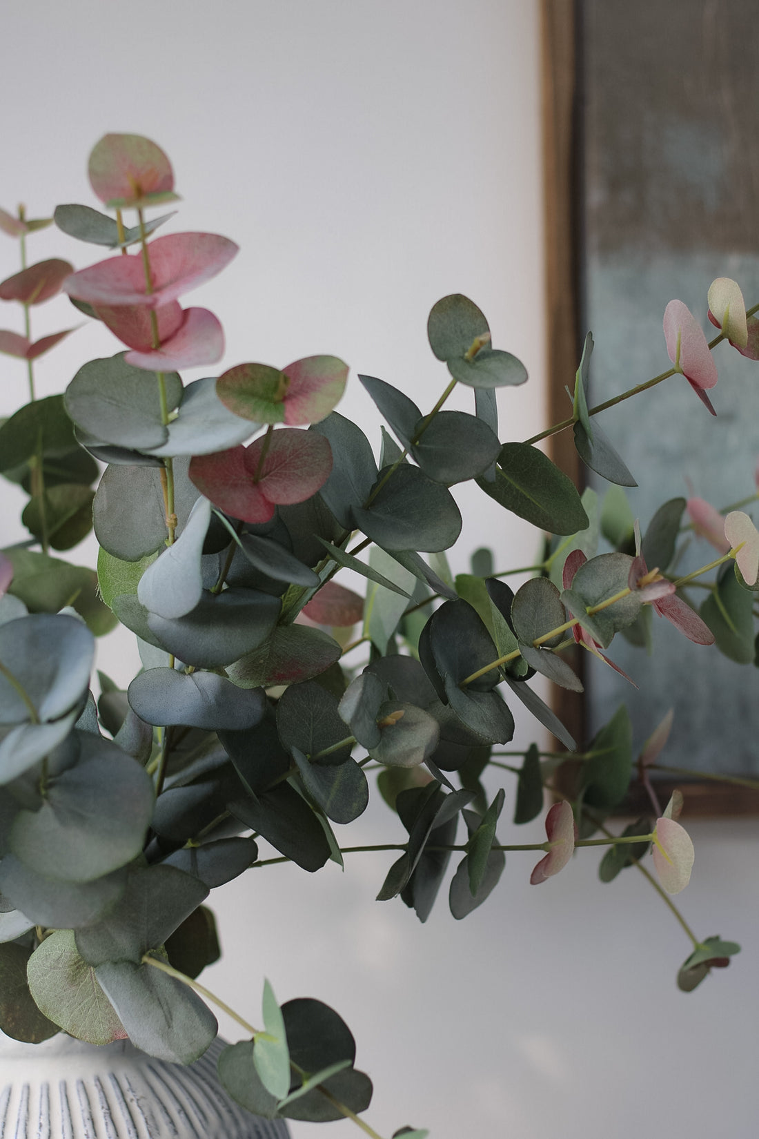 up close of faux blush eucalyptus leaves