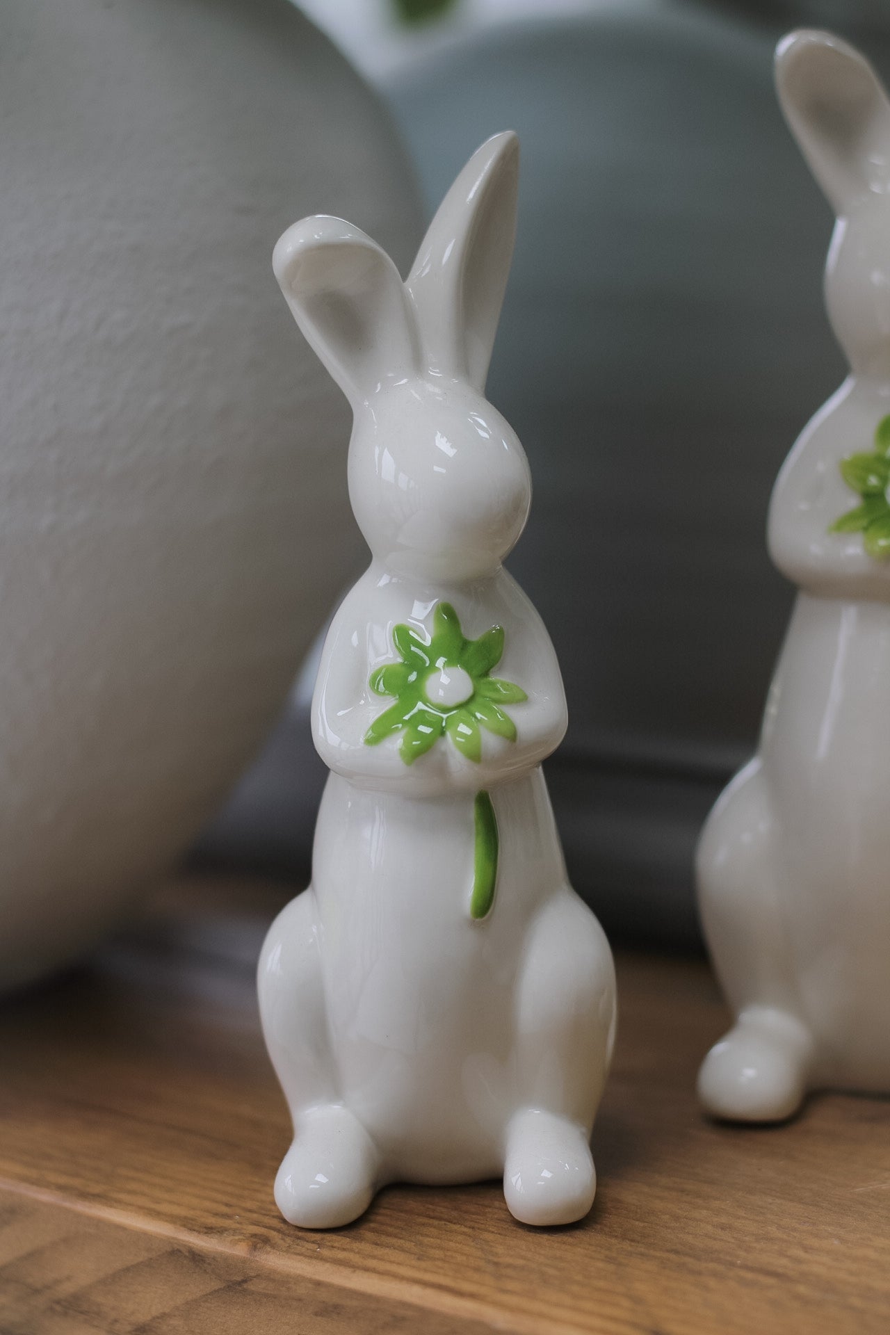 close up of porcelain bunny holding a flower