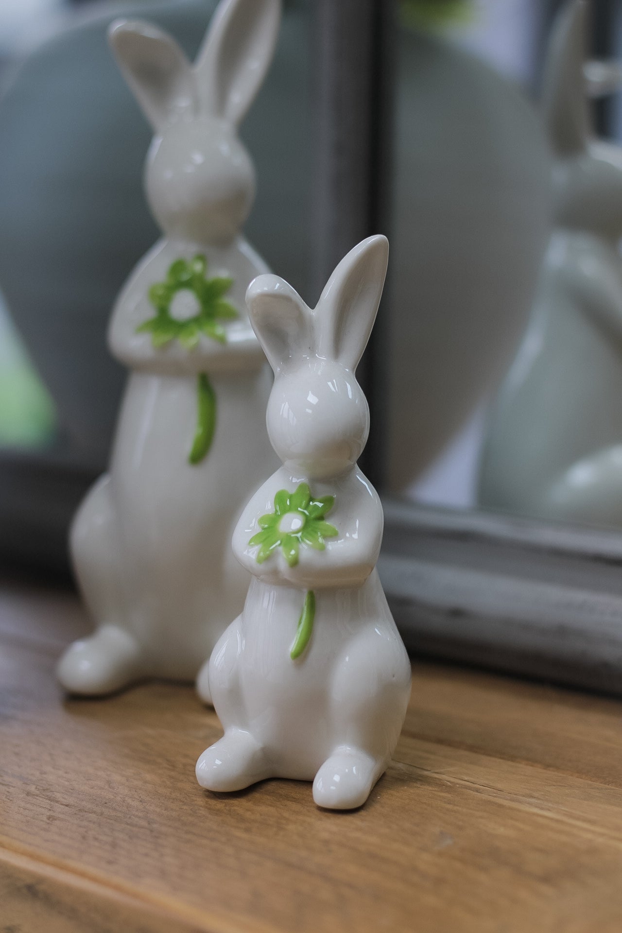 close up of porcelain bunny holding a flower