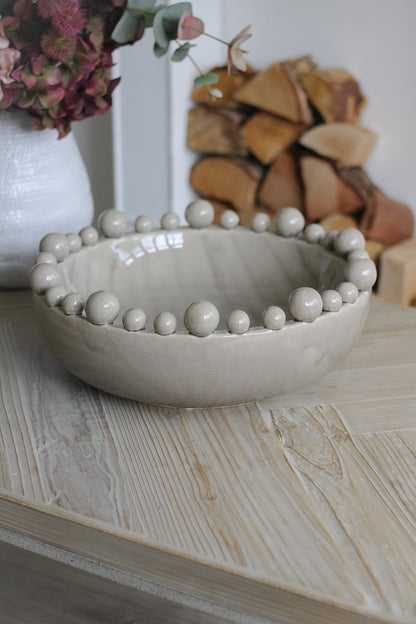 Grey Bobble Edged Bowl on wooden coffee table