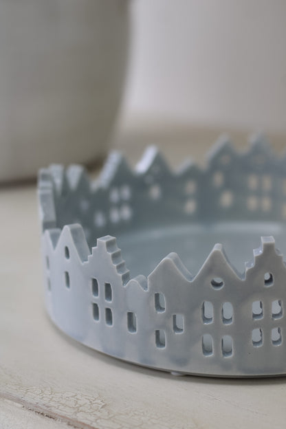 up close of grey ceramic winter scene tray