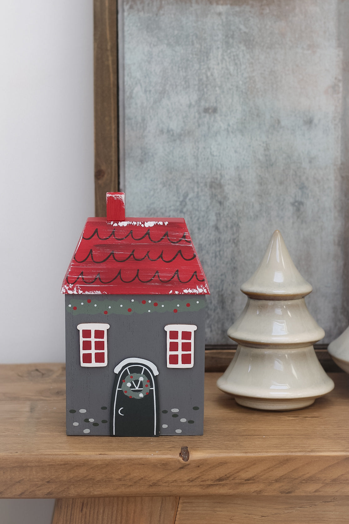 Small dark grey wooden christmas house, perfect for adding to your festive decorations this christmas time