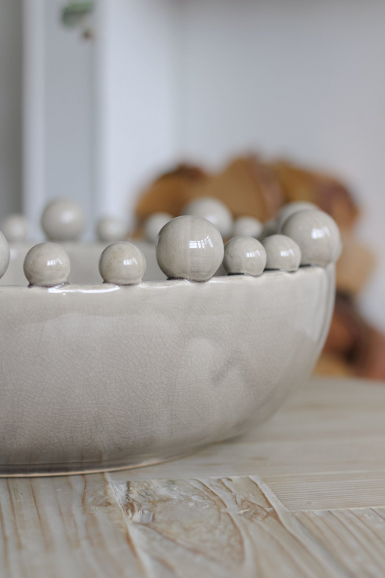 Side of grey ceramic bobble bowl