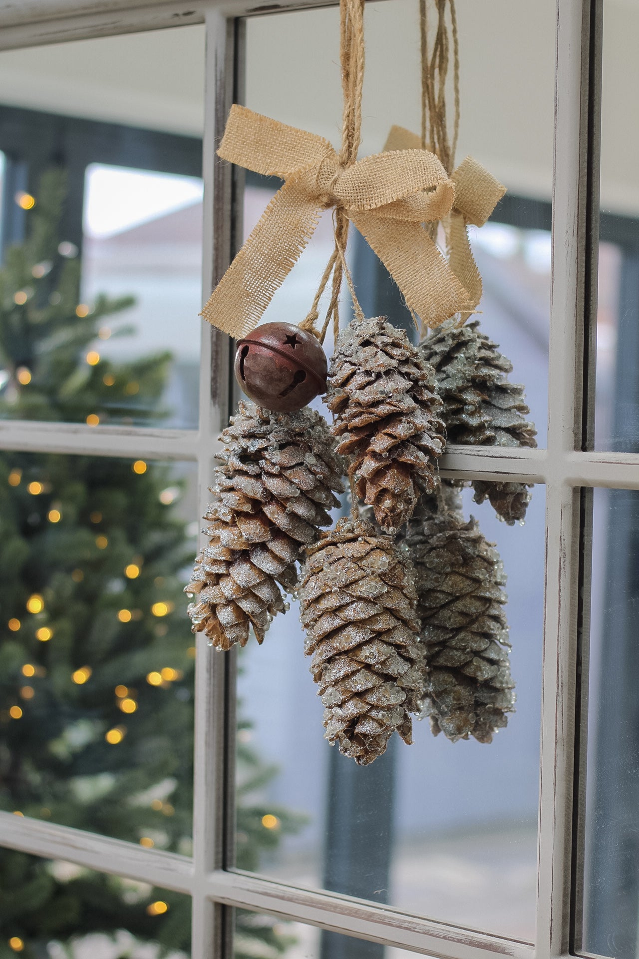 Hanging Pinecones and Rustic Bell with Hessian Bow for christmas decorations