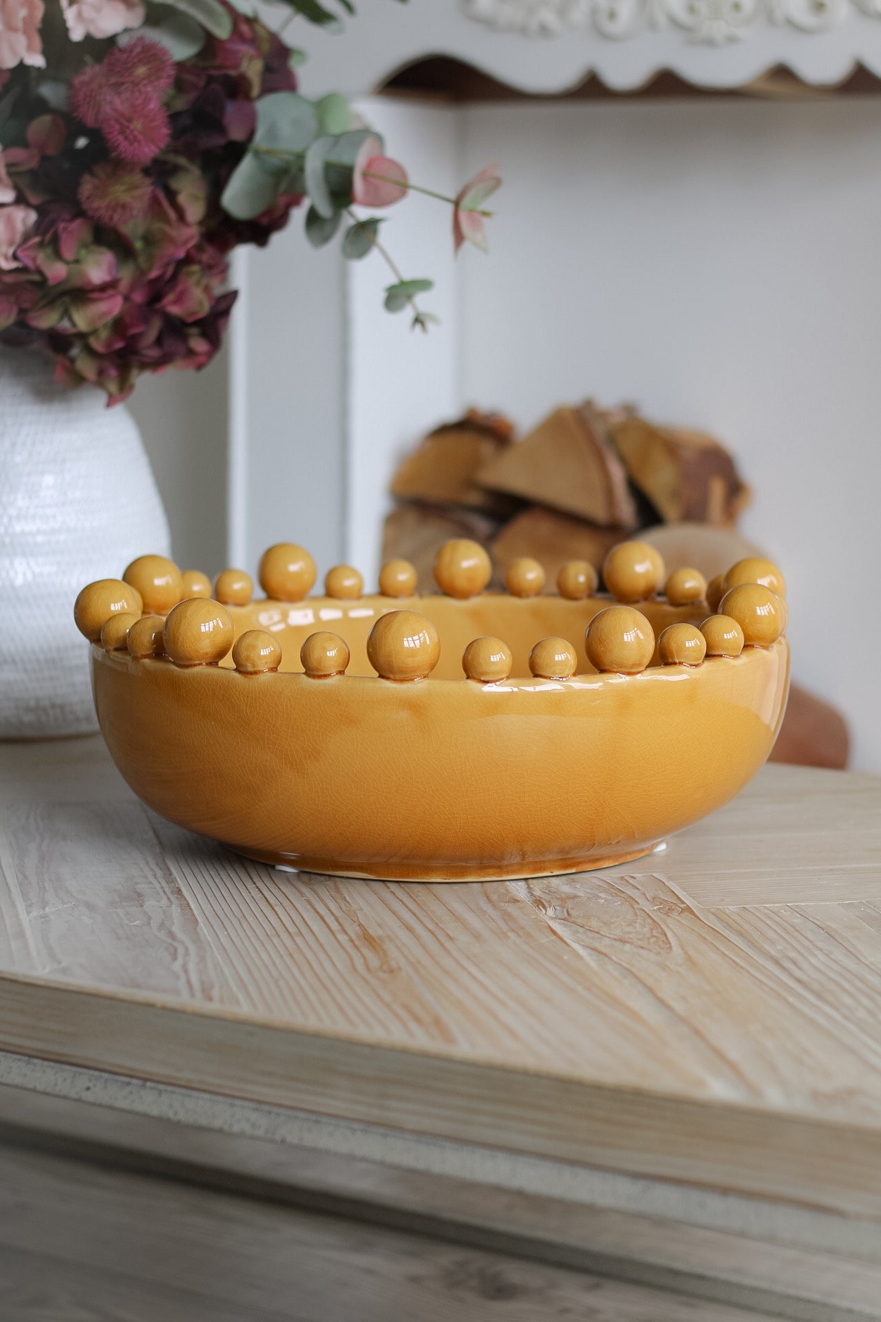 Mustard Bobble bowl on coffee table