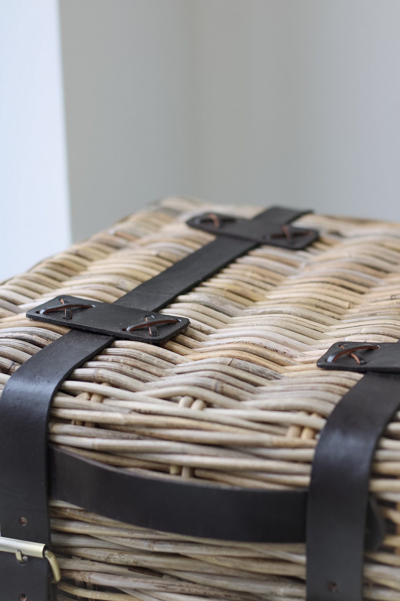 leather staps of rattan end table