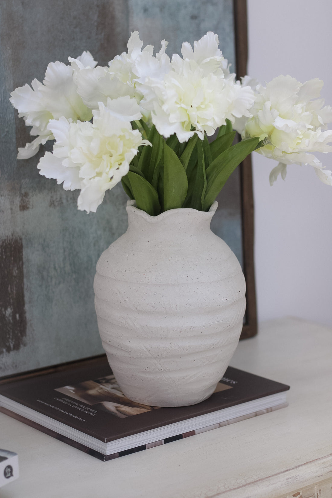 Rustic white ridged ceramic vase  with faux frilly parrot white tulips