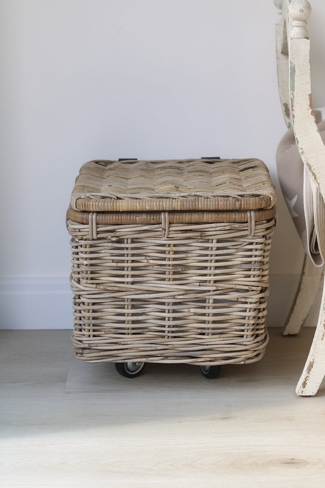 Practical wicker storage trunk on wheels with liner perfect for timeless home decor