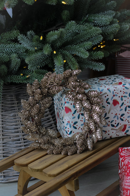 Small gold glittered pine cone wreath