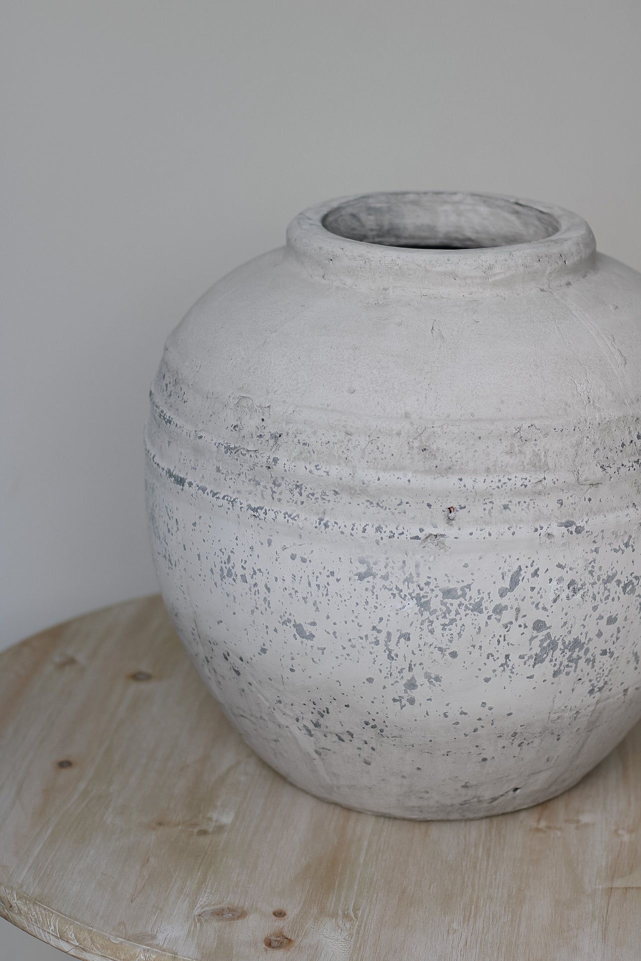 Stone vase on wooden table