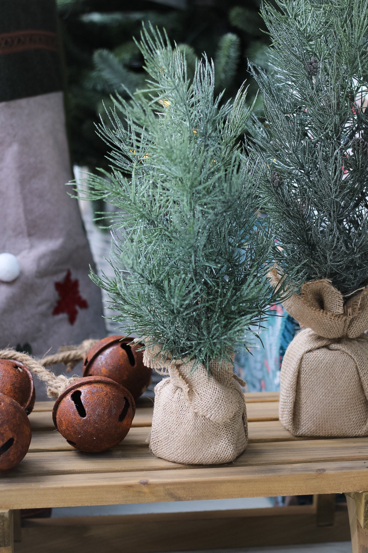 Faux pine tree on sleigh with metal bells