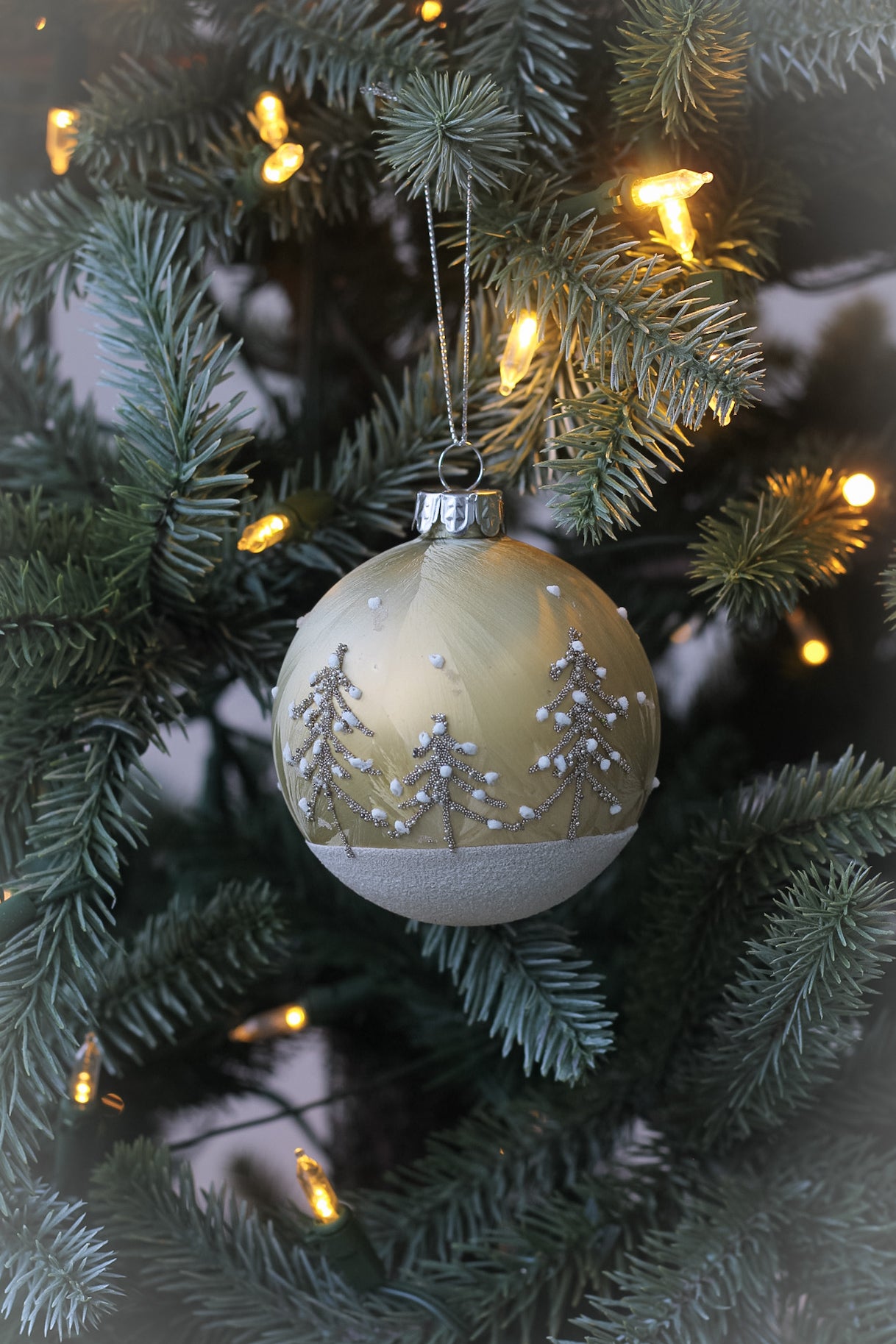 Elegant glass christmas tree bauble with delicate christmas tree design. 