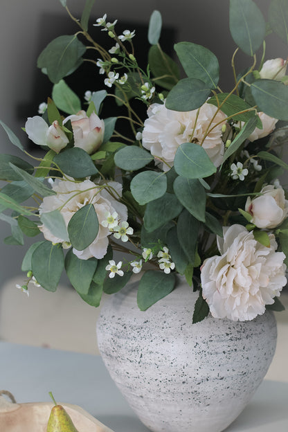 faux peonies and eucalyptus in vase