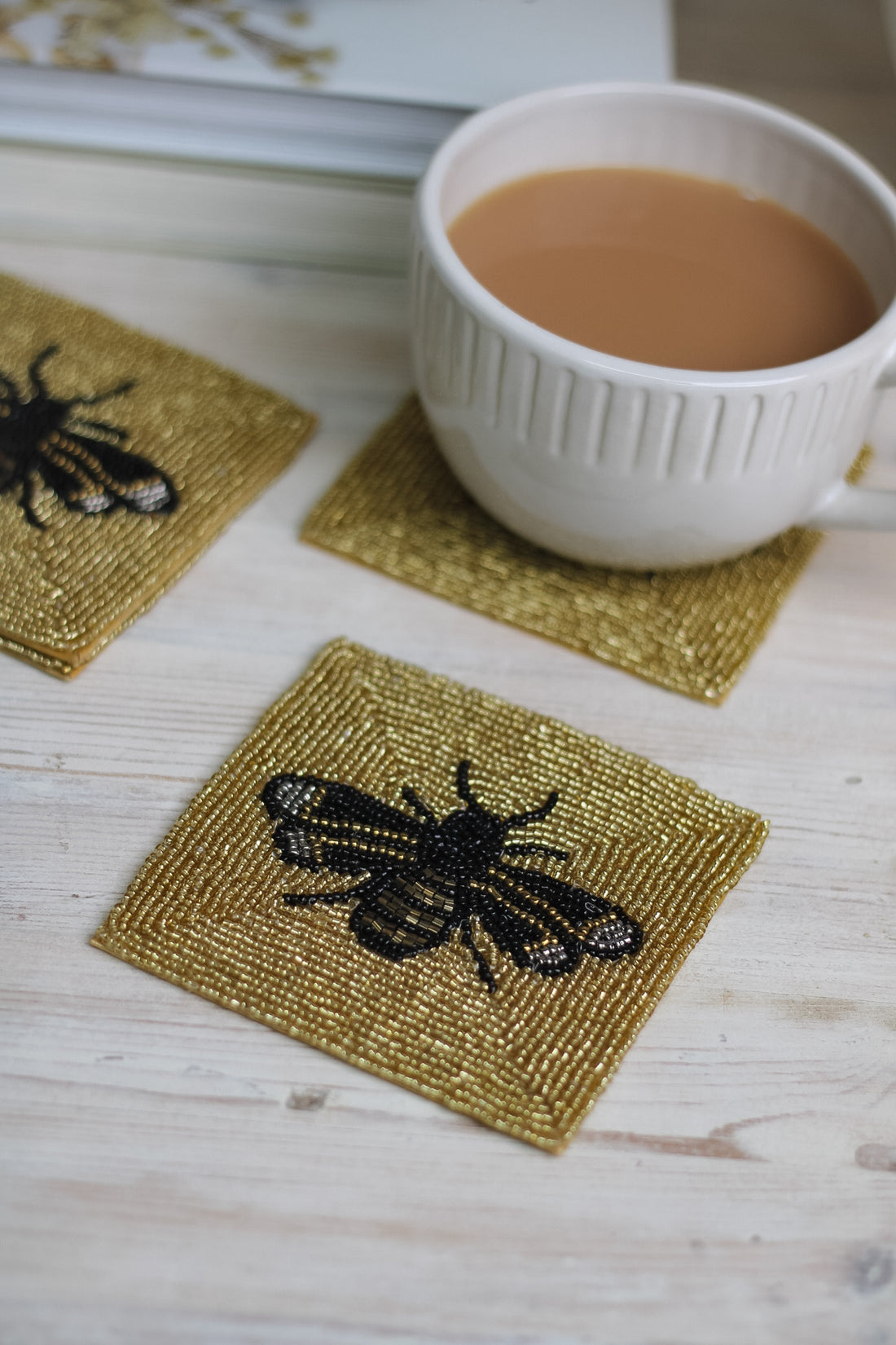 gold beaded bee coasters