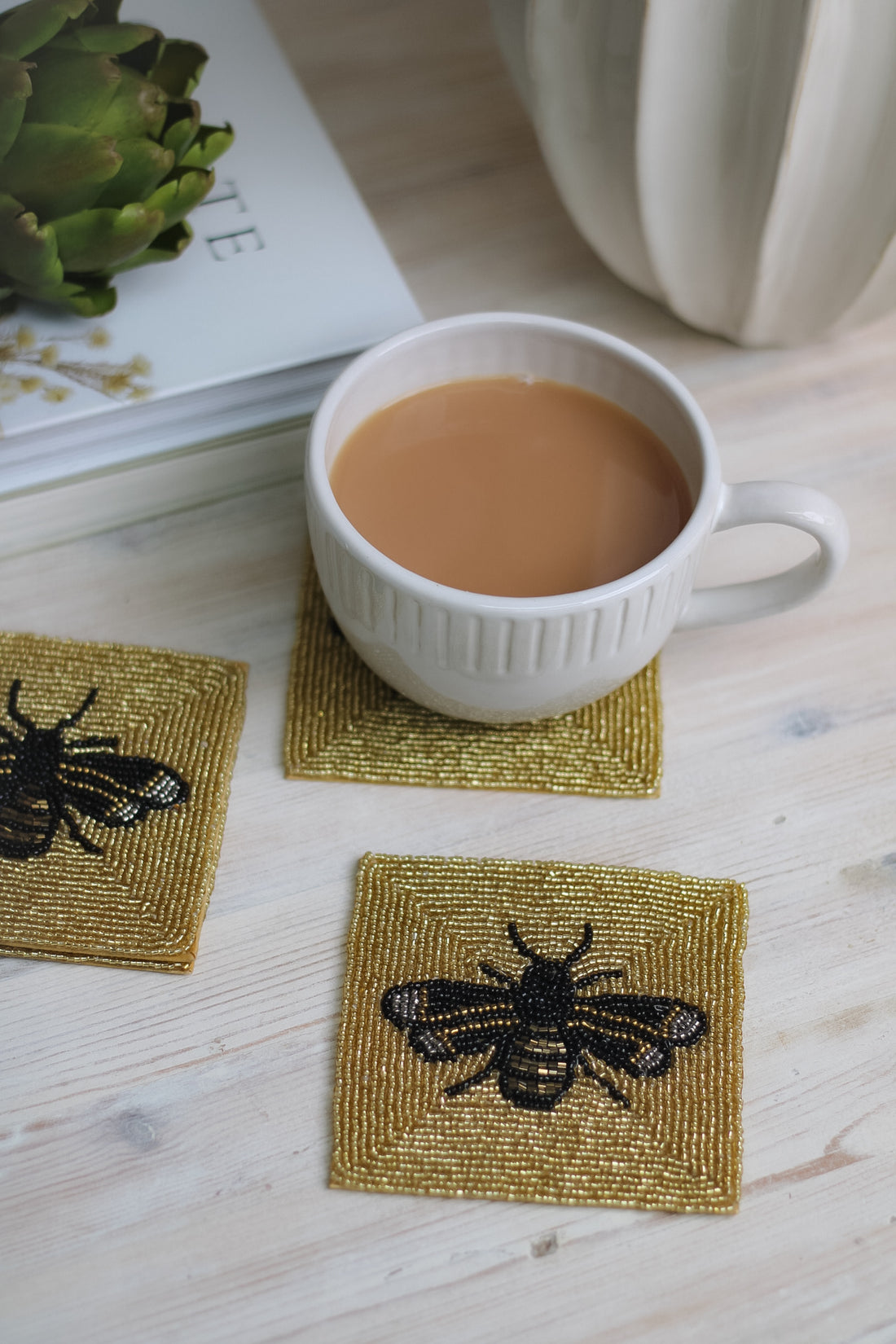 gold beaded bee coasters