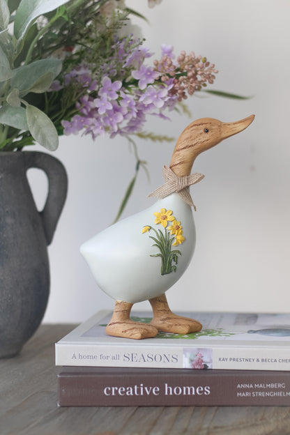 pale blue spring resin duck with daffodils