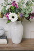 rustic white dotty vase filled with faux flowers, perfect for creating a statement in your home decor. Add a modern country touch to your home.