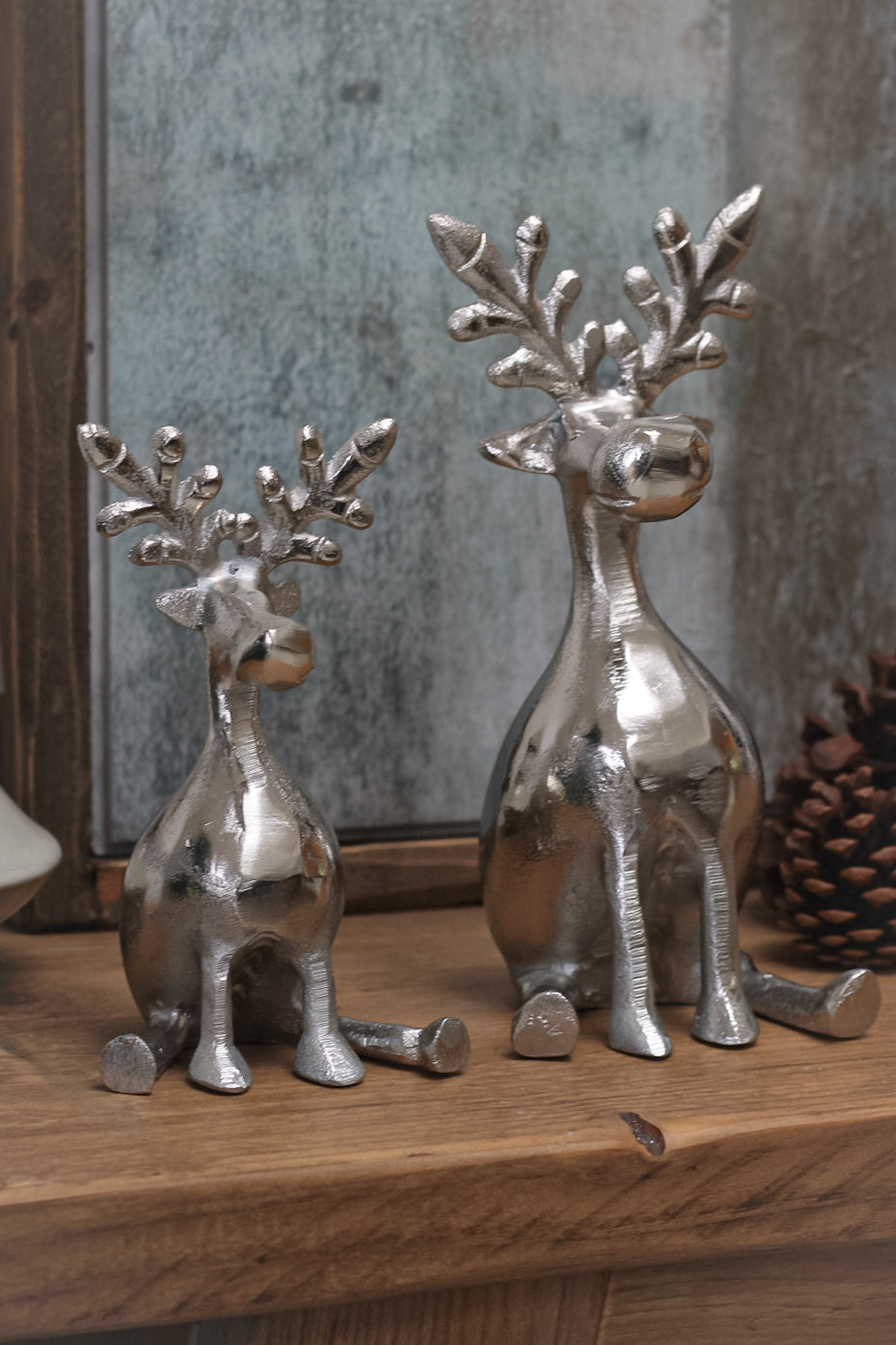 elegant pair of sitting silver reindeer, a lovely touch for your Christmas decorations