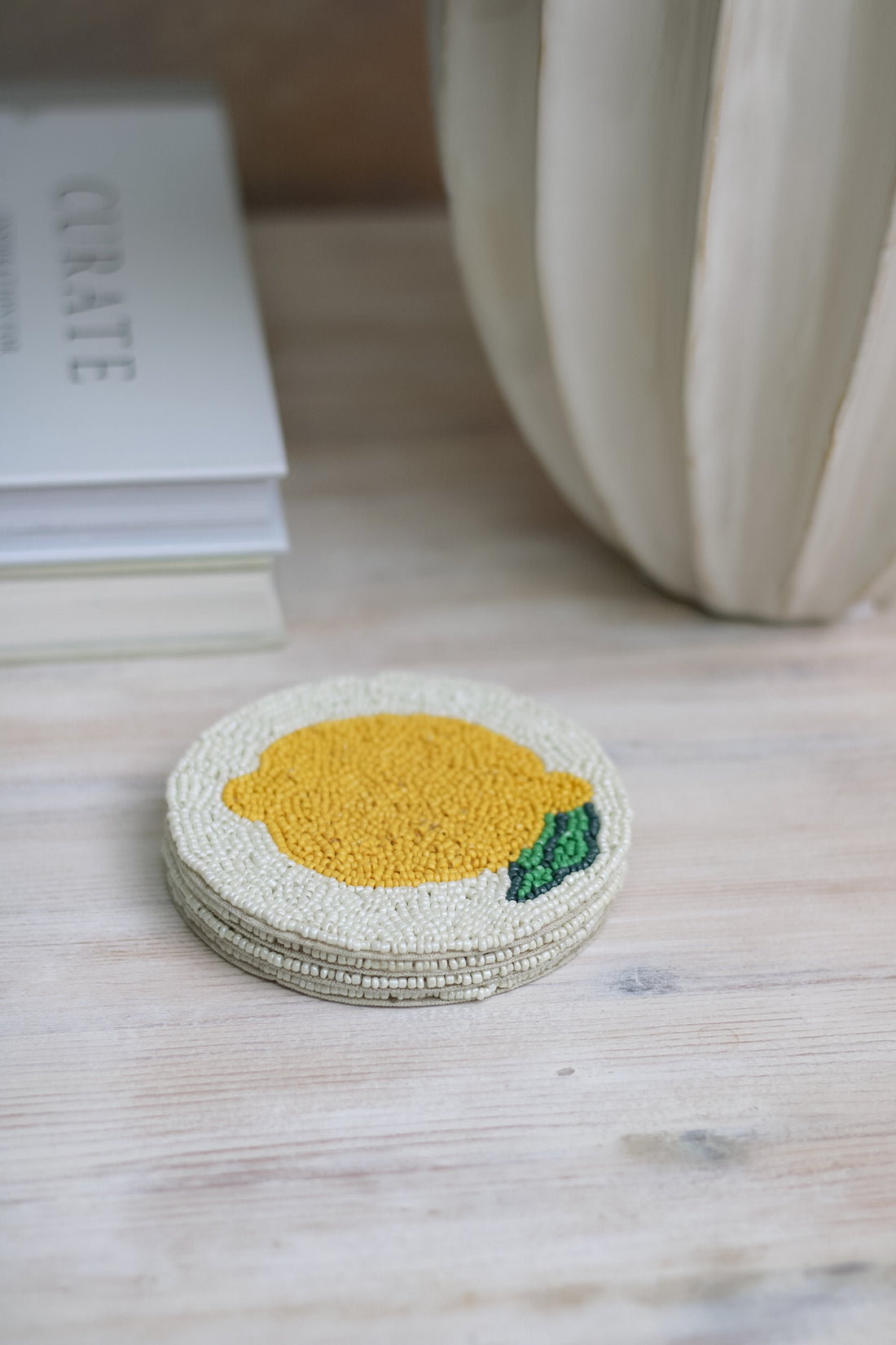 stack of 4 amalfi lemon beaded coasters