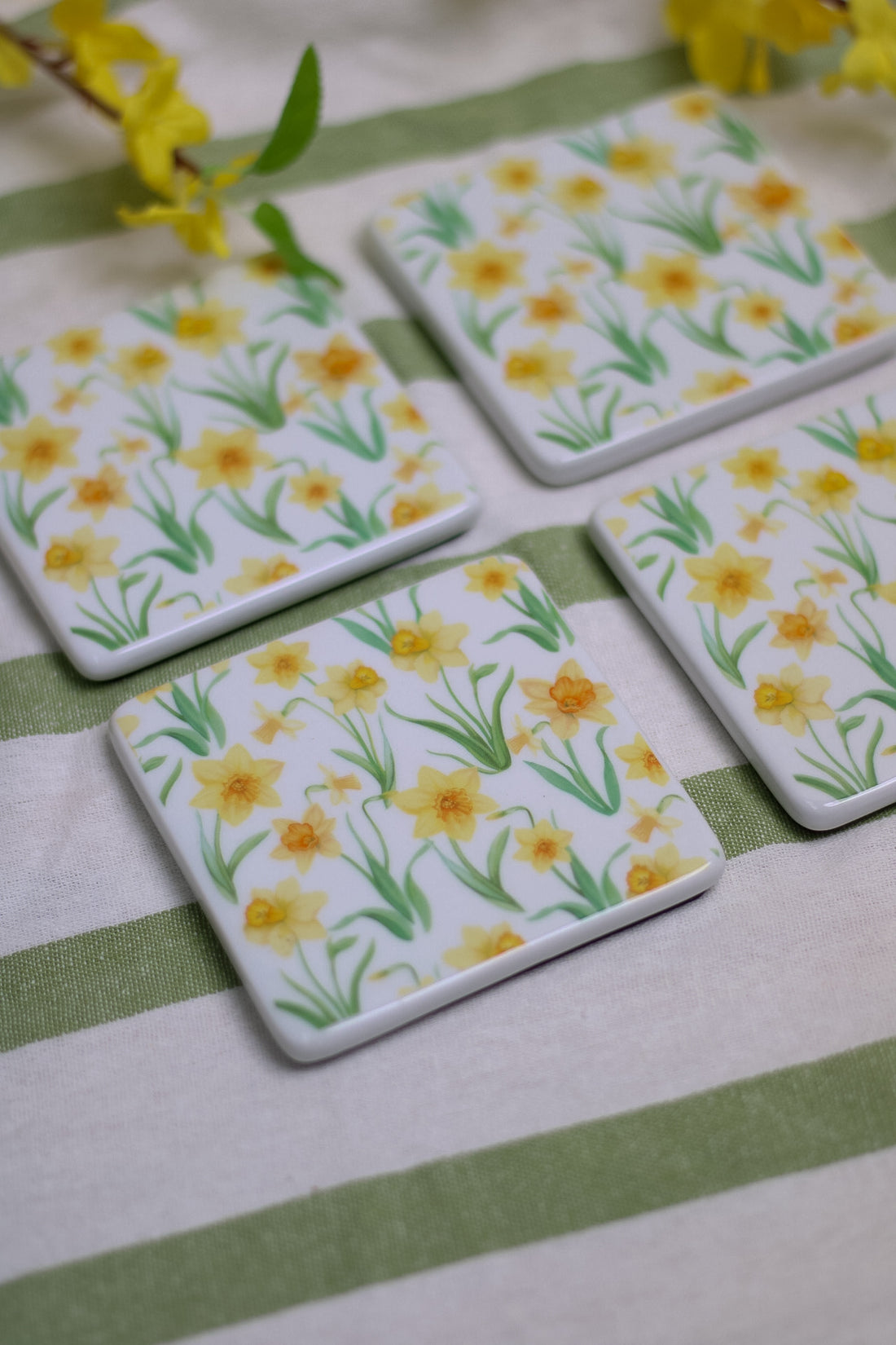 up close of porcelain daffodil coasters