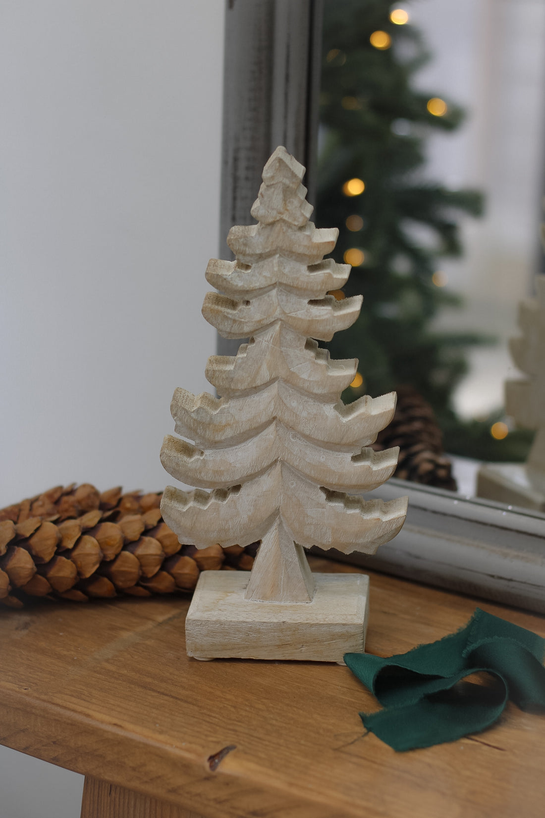 Wooden christmas tree with dark green ribbon